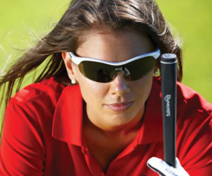 A woman using the Steady Swing golf training aid during putting.